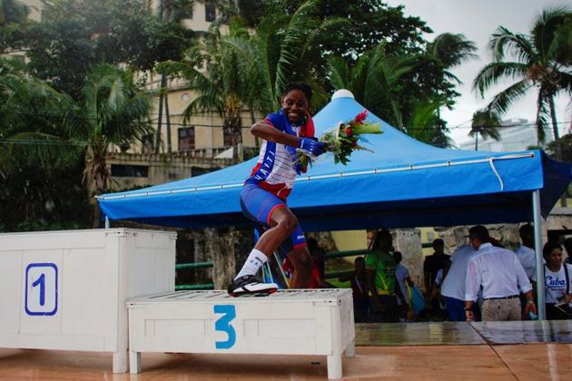 Ousline Georges, 22, a member of the Haiti national cycling team, jumps down from the podium after receiving a bronze medal for the individual time trial under 23 category at the Caribbean Cycling Championship in Havana, Cuba. “I was really moved,” said Georges, a student and mother of a four-year old boy. “When I saw the others cry over my victory, I cried too.” (Alexandre Meneghini / REUTERS)