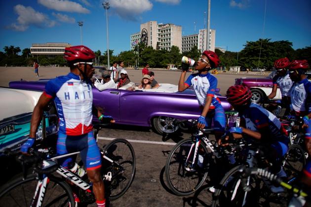 Members of the Haiti national cycling team take a break from a training session. Cycling is not an easy sport to practice in Haiti, a country wracked by poverty, natural catastrophes and political instability. (Alexandre Meneghini / REUTERS)