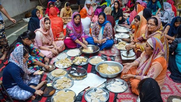 Woman prepare meals at a community kitchen in a Gurudwara on the occasion of 550th birth anniversary of Sikh Guru Nanak Dev in Mirzapur. The day is celebrated on the full moon day of the Kartik month as per the Hindu calendar. Hence, it is also known as Kartik Poornima (PTI) Woman prepare meals at a community kitchen in a Gurudwara on the occasion of 550th birth anniversary of Sikh Guru Nanak Dev in Mirzapur. The day is celebrated on the full moon day of the Kartik month as per the Hindu calendar. Hence, it is also known as Kartik Poornima (PTI)