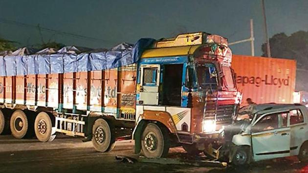 The collision was such that the car was crushed under the truck, a police officer said. (HT Photo) The collision was such that the car was crushed under the truck, a police officer said. (HT Photo)