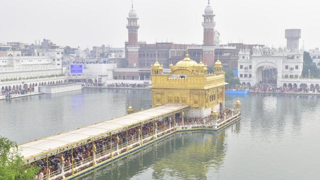 Devotees gather to pay obeisance at Golden Temple on the occasion of the 550th birth anniversary of Guru Nanak Dev, in Amritsar. Congress president Sonia Gandhi greeted Sikhs across the world and said that Guru Nanak’s teachings of mutual love, truthfulness, brotherhood and righteousness are of eternal relevance having universal and timeless appeal that cut across the sectarian, communal and regional divides. (Sameer Sehgal / HT Photo) Devotees gather to pay obeisance at Golden Temple on the occasion of the 550th birth anniversary of Guru Nanak Dev, in Amritsar. Congress president Sonia Gandhi greeted Sikhs across the world and said that Guru Nanak’s teachings of mutual love, truthfulness, brotherhood and righteousness are of eternal relevance having universal and timeless appeal that cut across the sectarian, communal and regional divides. (Sameer Sehgal / HT Photo)