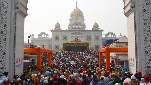 Devotees gather to pay obeisance at Bangla Sahib Gurudwara on the occasion of the 550th birth anniversary of Guru Nanak Dev in New Delhi. Guru Nanak Dev was the first Sikh Guru and the festival “Gurpurab” is celebrated by Sikhs all across the globe with fervour and joy. Guru Nanak Dev is considered as a preacher of peace and harmony. (Sanchit Khanna / HT Photo) Devotees gather to pay obeisance at Bangla Sahib Gurudwara on the occasion of the 550th birth anniversary of Guru Nanak Dev in New Delhi. Guru Nanak Dev was the first Sikh Guru and the festival “Gurpurab” is celebrated by Sikhs all across the globe with fervour and joy. Guru Nanak Dev is considered as a preacher of peace and harmony. (Sanchit Khanna / HT Photo)