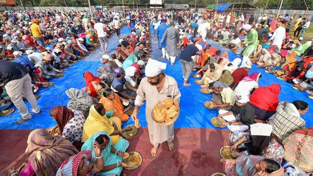 Free meal is being served among the devotees on the occasion of 550th birth anniversary of Sikh Guru Nanak Dev, at Shahid Minar Maidan in Kolkata. “Modi government is devoted to the thoughts and teachings of Guru Nanak Dev Ji, this is our prime motto of Sabka Saath, Sabka Vikas. The historic ‘Kartarpur Corridor’ dedicated to the countrymen by Modi ji on the 550th Prakash Parv of Guru Nanak Dev Ji is a real tribute to Guru Nanak Dev Ji,” Union Home Minister Amit Shah said in a tweet. (Swapan Mahapatra / PTI) Free meal is being served among the devotees on the occasion of 550th birth anniversary of Sikh Guru Nanak Dev, at Shahid Minar Maidan in Kolkata. “Modi government is devoted to the thoughts and teachings of Guru Nanak Dev Ji, this is our prime motto of Sabka Saath, Sabka Vikas. The historic ‘Kartarpur Corridor’ dedicated to the countrymen by Modi ji on the 550th Prakash Parv of Guru Nanak Dev Ji is a real tribute to Guru Nanak Dev Ji,” Union Home Minister Amit Shah said in a tweet. (Swapan Mahapatra / PTI)