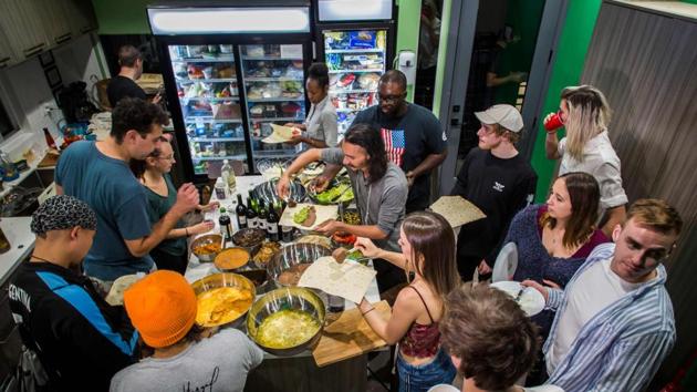 Young artists have dinner in the UP(st)ART house. The capsule-living concept is also catching on in other expensive US cities including New York. (Apu Gomes / AFP) Young artists have dinner in the UP(st)ART house. The capsule-living concept is also catching on in other expensive US cities including New York. (Apu Gomes / AFP)
