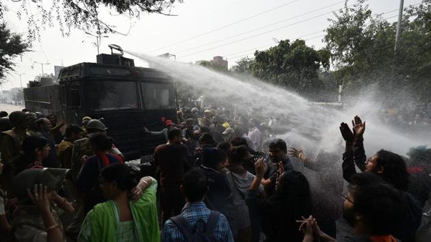 Students of Jawaharlal Nehru University (JNU) are fired upon by a water cannon during a protest. The university has hiked the rent for a single room from Rs 10 to Rs 300, that for a double room from Rs 20 to Rs 600 and one-time refundable mess security deposit from Rs 5,500 to Rs 12,000. (Biplov Bhuyan / HT Photo) Students of Jawaharlal Nehru University (JNU) are fired upon by a water cannon during a protest. The university has hiked the rent for a single room from Rs 10 to Rs 300, that for a double room from Rs 20 to Rs 600 and one-time refundable mess security deposit from Rs 5,500 to Rs 12,000. (Biplov Bhuyan / HT Photo)