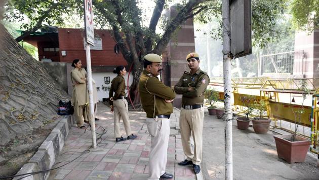 Delhi Police personnel stand guard at the entry gate of JNU in view of security precautions after a protest against fee hikes,in New Delhi. The university’s hostel committee had already approved the manual during a meeting on October 28, without consulting representatives of the students’ union. The varsity’s students body — Jawaharlal Nehru University Students’ Union (JNUSU) — has organised several protests on campus and demanded a rollback since. (Vipin Kumar / HT PHOTO) Delhi Police personnel stand guard at the entry gate of JNU in view of security precautions after a protest against fee hikes,in New Delhi. The university’s hostel committee had already approved the manual during a meeting on October 28, without consulting representatives of the students’ union. The varsity’s students body — Jawaharlal Nehru University Students’ Union (JNUSU) — has organised several protests on campus and demanded a rollback since. (Vipin Kumar / HT PHOTO)
