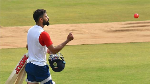 Indian cricket captain Virat Kohli throws the new pink ball ahead of the first Test match against Bangladesh, in Indore, Wednesday, Nov 13, 2019.(PTI)