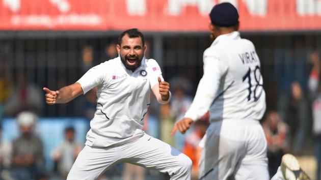 Indian bowler M Shami (L) celebrates the wicket of Bangladesh batsman Mushfiqur Rahim.(PTI)