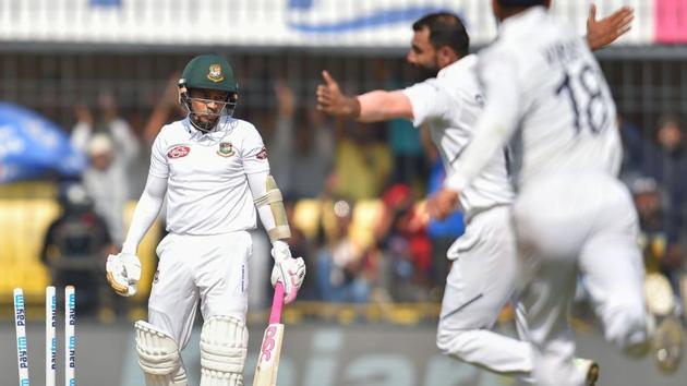 Indian bowler Mohammed Shami celebrates the wicket of Bangladesh batsman Mushfiqur Rahim during the first day of the first Test match between India and Bangladesh at the Holkar Cricket Stadium, in Indore.(PTI)