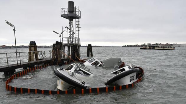 Partially submerged ferry boats in Venice. Outside historic Venice, the Lido and Pellestrina islands were also hard hit by flooding (Luigi Costantini / AP) Partially submerged ferry boats in Venice. Outside historic Venice, the Lido and Pellestrina islands were also hard hit by flooding (Luigi Costantini / AP)
