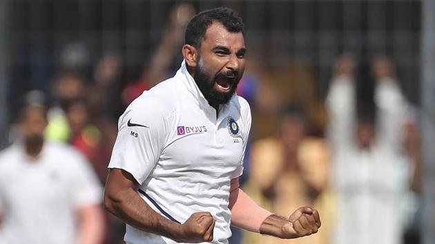 India's Mohammed Shami celebrates the dismissal of Bangladesh's Mehidy Hasan.(AP)