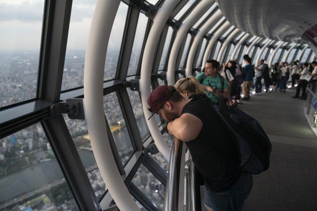 Tourists watch the cityscape of Tokyo from the observation deck of Tokyo Skytree, in Tokyo. The Skytree is the tallest tower in the world. No two perches of the observation decks offer the same view, but they are all spectacular. (Jae C. Hong / AP) Tourists watch the cityscape of Tokyo from the observation deck of Tokyo Skytree, in Tokyo. The Skytree is the tallest tower in the world. No two perches of the observation decks offer the same view, but they are all spectacular. (Jae C. Hong / AP)