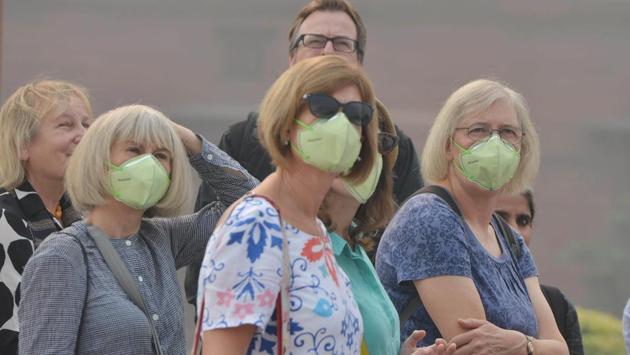 Tourists wear masks as heavy smog polluting the air quality, in New Delhi on Wednesday. Pollution levels in the national capital will continue to deteriorate to nearly ‘emergency’ zone on Thursday, government agencies had earlier warned. The air quality index (AQI), as calculated by the Central Pollution Control Board (CPCB) at 7 am was 463 and the wind speed was zero. This was against the overall AQI reading of 456 on Wednesday. (ANI) Tourists wear masks as heavy smog polluting the air quality, in New Delhi on Wednesday. Pollution levels in the national capital will continue to deteriorate to nearly ‘emergency’ zone on Thursday, government agencies had earlier warned. The air quality index (AQI), as calculated by the Central Pollution Control Board (CPCB) at 7 am was 463 and the wind speed was zero. This was against the overall AQI reading of 456 on Wednesday. (ANI)