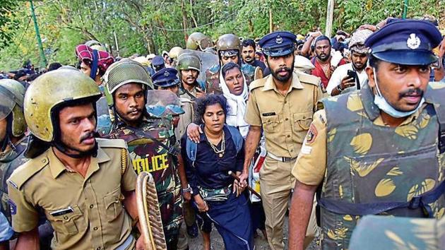 Bindu Ammini and Kanaka Durga are escorted by police after they attempted to enter the Sabarimala temple in Pathanamthitta district in Kerala.(Reuters)