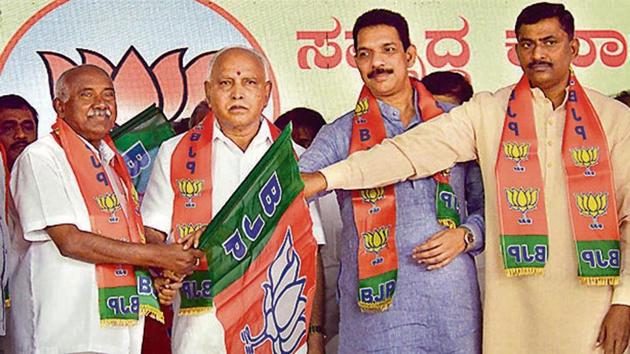 Former JD(S) leader AH Vishwanath (2L) joins BJP in presence of Karnataka CM BS Yediyurappa (C) Deputy CM C N Ashwath Narayan (L), state BJP president Nalin Kumar Kateel (2R) and BJP national general secretary P Muralidhar Rao (R) during a function at BJP office, in Bengaluru on Thursday. (Photo: PTI) Former JD(S) leader AH Vishwanath (2L) joins BJP in presence of Karnataka CM BS Yediyurappa (C) Deputy CM C N Ashwath Narayan (L), state BJP president Nalin Kumar Kateel (2R) and BJP national general secretary P Muralidhar Rao (R) during a function at BJP office, in Bengaluru on Thursday. (Photo: PTI)