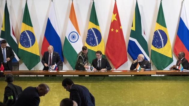 China's President Xi Jinping, left, Russia's President Vladimir Putin, second from left, Brazil's President Jair Bolsonaro, center, India's Prime Minister Narendra Modi, second from right, and South Africa's President Cyril Ramaphosa leave after a meeting during the BRICS emerging economies, Brasilia, Brazil, Thursday, Nov. 14, 2019. (AP) China's President Xi Jinping, left, Russia's President Vladimir Putin, second from left, Brazil's President Jair Bolsonaro, center, India's Prime Minister Narendra Modi, second from right, and South Africa's President Cyril Ramaphosa leave after a meeting during the BRICS emerging economies, Brasilia, Brazil, Thursday, Nov. 14, 2019. (AP)
