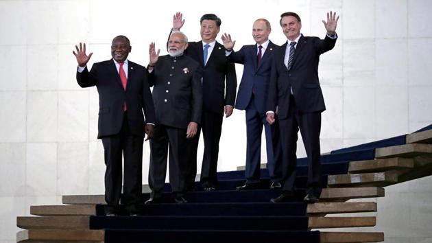 Jair Bolsonaro, Vladimir Putin, Xi Jinping, Narendra Modi, and Cyril Ramaphosa, pose for a photograph as they arrive for the BRICS summit in Brasilia, Brazil. (Ueslei Marcelino / REUTERS)