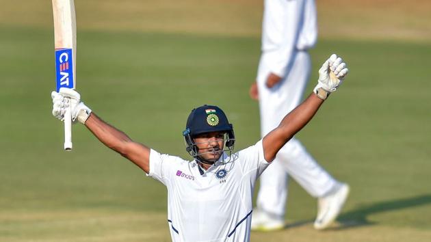 Indian batsman Mayank Agarwal celebrates after scoring a double century.(PTI)