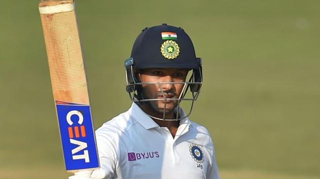 Indian batsman Mayank Agarwal holds up his bat after scoring double ton.(PTI)