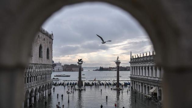 A general view shows the Doge's Palace overlooking the flooded St. Mark's Square, the Lion of St. Mark winged bronze statue, gondolas and the Venetian lagoon in Venice. Italy was poised to declare a state of emergency for Venice after an exceptional tide surged through churches, shops and homes, causing millions of euros worth of damage to the UNESCO city. (Marco Bertorello / AFP)