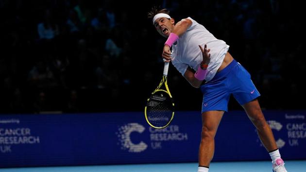 Spain's Rafael Nadal serves against Russia's Daniil Medvedev during their men's singles round-robin match on day four of the ATP World Tour Finals tennis tournament at the O2 Arena in London. (Adrian DENNIS / AFP)