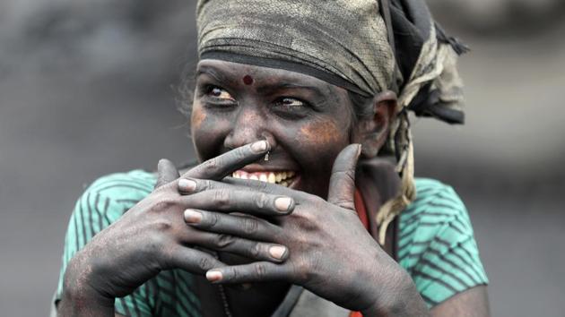 Over the years, the number of people needing to be resettled has risen to at least 130,000 families. As the government deadline of 2021 approaches, the lives of people in the fire-affected areas are getting harder. With few jobs available, many young people work as coal loaders for less than $4 a day or risk their lives scavenging coal. (Aijaz Rahi / AP) Over the years, the number of people needing to be resettled has risen to at least 130,000 families. As the government deadline of 2021 approaches, the lives of people in the fire-affected areas are getting harder. With few jobs available, many young people work as coal loaders for less than $4 a day or risk their lives scavenging coal. (Aijaz Rahi / AP)