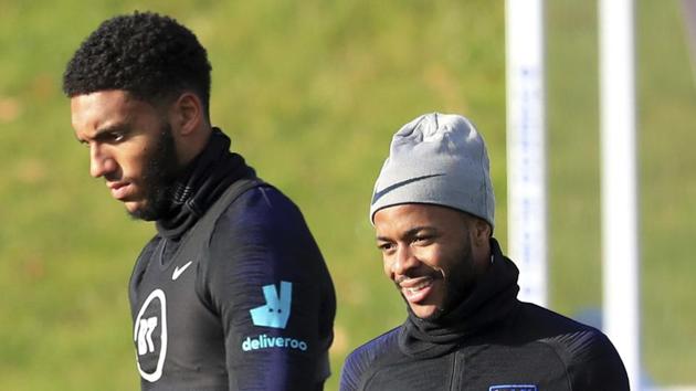 Joe Gomez, left and Raheem Sterling take part in a training session at St George's Park, in Burton, England.(AP)