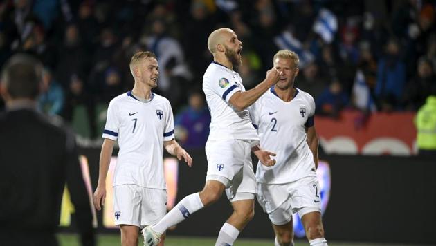 Teemu Pukki of Finland celebrates his goal with Jasse Tuominen and Paulus Arajuuri. (REUTERS) Teemu Pukki of Finland celebrates his goal with Jasse Tuominen and Paulus Arajuuri. (REUTERS)