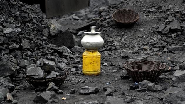 A metal vessel filled with drinking water is seen at a coal loading site Godhar village. The coal fires pose an even greater threat to the lives of those who work in the mines, which cover more than 260 square kilometers. (Aijaz Rahi / AP) A metal vessel filled with drinking water is seen at a coal loading site Godhar village. The coal fires pose an even greater threat to the lives of those who work in the mines, which cover more than 260 square kilometers. (Aijaz Rahi / AP)