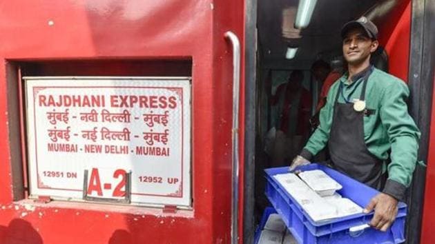 An Indian Railway Catering and Tourism Corporation (IRCTC ) worker carries foods in the newly launched eco-friendly disposable plates serving of meals to the passengers on Rajdhani Express train at New Delhi Railway Station in New Delhi.(File photo: PTI) An Indian Railway Catering and Tourism Corporation (IRCTC ) worker carries foods in the newly launched eco-friendly disposable plates serving of meals to the passengers on Rajdhani Express train at New Delhi Railway Station in New Delhi.(File photo: PTI)