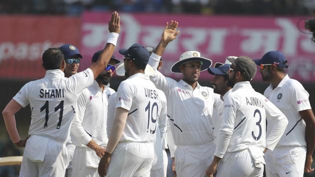 India's Mohammed Shami, second left, celebrates with teammates the dismissal of Bangladesh's captain Mominul Haque.(AP)