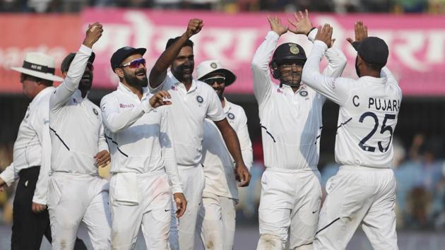 India's Ravichandran Ashwin, center, and teammates celebrate.(AP)