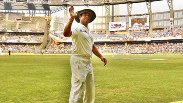 Sachin Tendulkar waves at the crowd during his final Test at Wankhede Stadium. (PTI Photo)(PTI Photo)