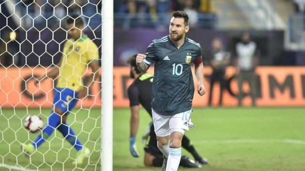Lionel Messi celebrates after scoring his side's opening goal during a friendly match between Brazil and Argentina at King Fahd stadium in Riyadh, Saudi Arabia.(AP)