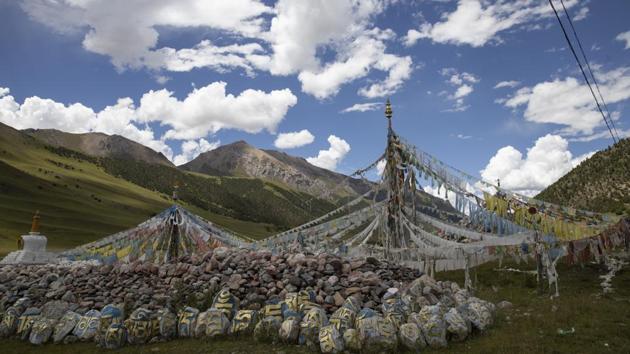 Tibetan prayer flags are seen during a clear day in Angsai, inside the Sanjiangyuan region in western China’s Qinghai province. Qinghai is a vast region in western China adjoining Tibet and shares much of its cultural legacy. In August, policymakers and scientists from China, the US and other countries convened in Xining, capital of Qinghai province, to discuss China’s plans to create a unified system with clear standards for limiting development and protecting ecosystems. (Ng Han Guan / AP)