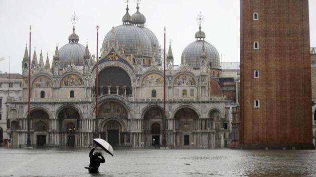 Many people were rising to the challenge of saving Venice’s many treasures.(Luca Bruno/AP)