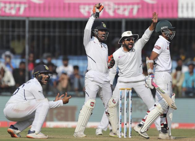 From left, India's Mayank Agarwal, Wriddhiman Saha and Rohit Sharma appeal. (AP)