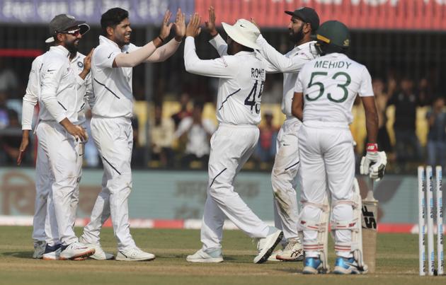 India's Umesh Yadav, second left, celebrates with teammates. (AP)