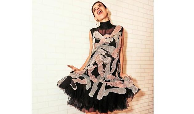 We absolutely love the crazy, fun vibe of this ‘handsy’ dress by Abhishek Studio, the high-neck complements Kalki’s long neck, and the pink shoes add a fun element to the already quirky dress. (Instagram) We absolutely love the crazy, fun vibe of this ‘handsy’ dress by Abhishek Studio, the high-neck complements Kalki’s long neck, and the pink shoes add a fun element to the already quirky dress. (Instagram)