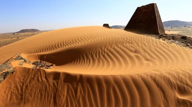 Desert sands surround the Royal Cemeteries of Meroe Pyramids in Begrawiya at River Nile State, Sudan. Portuguese architect Tania Monteiro and her husband are almost alone as they tour Sudan’s pyramids, a world-class attraction long neglected by the world. “People are really, really nice, always very welcoming,” Monteiro said on a recent visit to Meroe, an ancient city on the east bank of the River Nile about 200 km (125 miles) northeast of the capital Khartoum. (Mohamed Nureldin Abdallah / REUTERS) Desert sands surround the Royal Cemeteries of Meroe Pyramids in Begrawiya at River Nile State, Sudan. Portuguese architect Tania Monteiro and her husband are almost alone as they tour Sudan’s pyramids, a world-class attraction long neglected by the world. “People are really, really nice, always very welcoming,” Monteiro said on a recent visit to Meroe, an ancient city on the east bank of the River Nile about 200 km (125 miles) northeast of the capital Khartoum. (Mohamed Nureldin Abdallah / REUTERS)