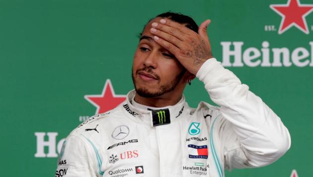Lewis Hamilton on the podium after finishing in third place before a penalty resulted in him being demoted to seventh. (REUTERS)