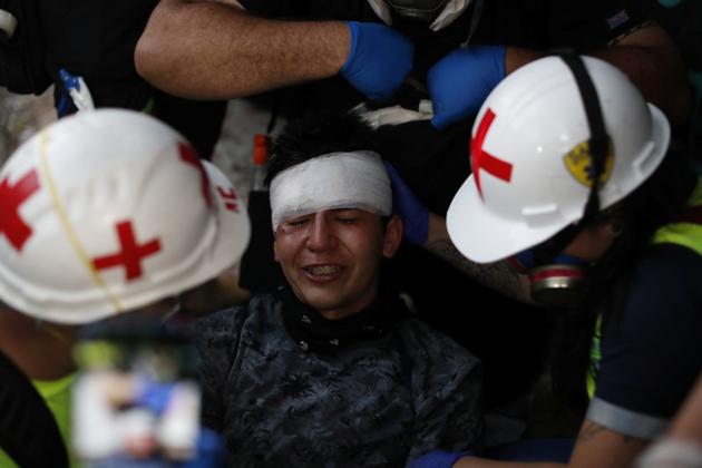 Medical personnel tend to an injured demonstrator during a protest against Chile's government in Santiago. Public prosecutors in Chile are investigating more than 1,000 cases of alleged abuses - ranging from torture to sexual violence - by security forces during weeks of anti-government unrest. That could double to more than 2,000, said Ymay Ortiz, head of the public prosecutor’s rights division. (Jorge Silva / REUTERS) Medical personnel tend to an injured demonstrator during a protest against Chile's government in Santiago. Public prosecutors in Chile are investigating more than 1,000 cases of alleged abuses - ranging from torture to sexual violence - by security forces during weeks of anti-government unrest. That could double to more than 2,000, said Ymay Ortiz, head of the public prosecutor’s rights division. (Jorge Silva / REUTERS)