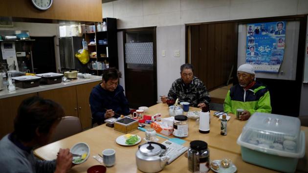 Kawasaki eats breakfast with his fellow fishermen at a port on Ikitsuki Island. “I worry that what my ancestors worked hard to preserve will disappear, but that is the trend of the times,” said Kawasaki, who prays each evening at home before the altar, flanked by others devoted to Buddhist and Shinto gods. “I have a son but I don’t expect him to carry on,” he added. “To think this will disappear is sad, without a doubt.” (Issei Kato / REUTERS) Kawasaki eats breakfast with his fellow fishermen at a port on Ikitsuki Island. “I worry that what my ancestors worked hard to preserve will disappear, but that is the trend of the times,” said Kawasaki, who prays each evening at home before the altar, flanked by others devoted to Buddhist and Shinto gods. “I have a son but I don’t expect him to carry on,” he added. “To think this will disappear is sad, without a doubt.” (Issei Kato / REUTERS)