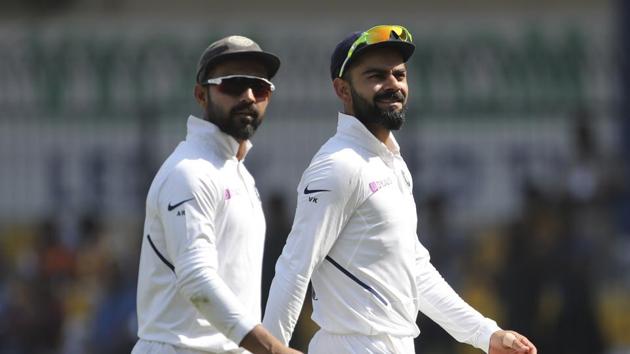 Virat Kohli, right, and Ajinkya Rahane during the first Test match between India and Bangladesh in Indore.(AP)