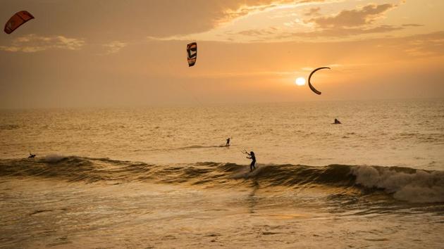 Kitesurfers riding at sunset at Dakhla beach in Western Sahara. In the heart of disputed Western Sahara, a former garrison town has become an unlikely tourist magnet after kitesurfers discovered the windswept desert coast was perfect for their sport. In Dakhla, an Atlantic seaport town punctuated with military buildings in Western Sahara, swarms of kitesurfers now sail in the lagoon daily. (FADEL SENNA / AFP) Kitesurfers riding at sunset at Dakhla beach in Western Sahara. In the heart of disputed Western Sahara, a former garrison town has become an unlikely tourist magnet after kitesurfers discovered the windswept desert coast was perfect for their sport. In Dakhla, an Atlantic seaport town punctuated with military buildings in Western Sahara, swarms of kitesurfers now sail in the lagoon daily. (FADEL SENNA / AFP)