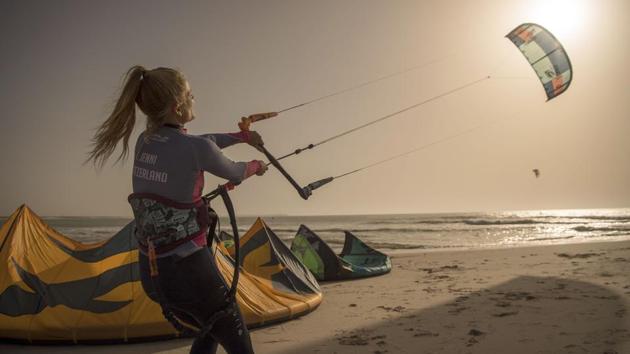 A kitesurfer maneuvering her kite at Dakhla beach. “Here there is nothing other than sun, wind and waves. We turned the adversity of the elements to our advantage: that’s the very principle of kitesurfing,” said Rachid Roussafi. After an international career in windsurfing and kitesurfing, Roussafi founded the first tourist camp at the lagoon at the start of the 2000s. “At the time, a single flight a week landed in Dakhla.” (FADEL SENNA / AFP) A kitesurfer maneuvering her kite at Dakhla beach. “Here there is nothing other than sun, wind and waves. We turned the adversity of the elements to our advantage: that’s the very principle of kitesurfing,” said Rachid Roussafi. After an international career in windsurfing and kitesurfing, Roussafi founded the first tourist camp at the lagoon at the start of the 2000s. “At the time, a single flight a week landed in Dakhla.” (FADEL SENNA / AFP)