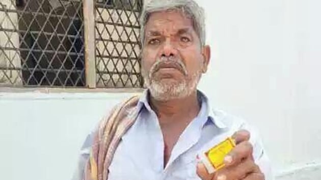 Farmer Jeella Kanakaiah threatening to set ablaze three persons at the office of Chigurumamidi tehsildar in Telangana’s Karimnagar moments before he was overpowered. (Sourced) Farmer Jeella Kanakaiah threatening to set ablaze three persons at the office of Chigurumamidi tehsildar in Telangana’s Karimnagar moments before he was overpowered. (Sourced)