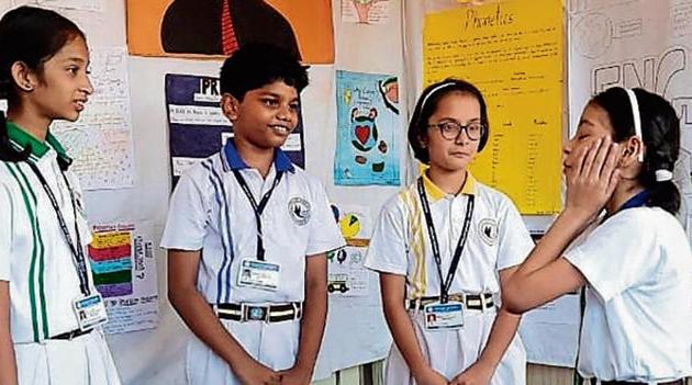Students celebrate the English language. (HT) Students celebrate the English language. (HT)