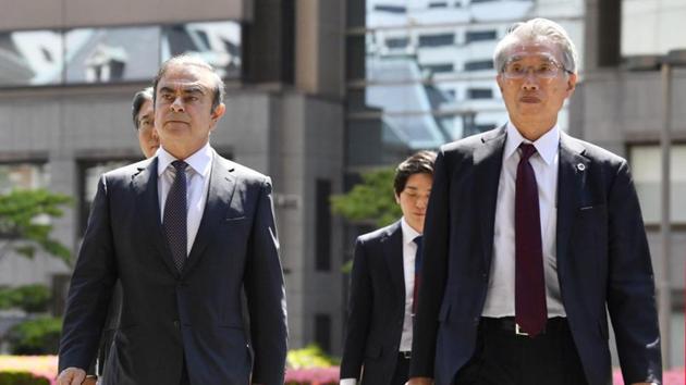 Former Nissan Motor Co. Chairman Carlos Ghosn and his lawyer Junichiro Hironaka arrive at the Tokyo District Court for the first pretrial procedures in his financial misconduct case, in Tokyo, Japan. (Kyodo/via REUTERS) Former Nissan Motor Co. Chairman Carlos Ghosn and his lawyer Junichiro Hironaka arrive at the Tokyo District Court for the first pretrial procedures in his financial misconduct case, in Tokyo, Japan. (Kyodo/via REUTERS)