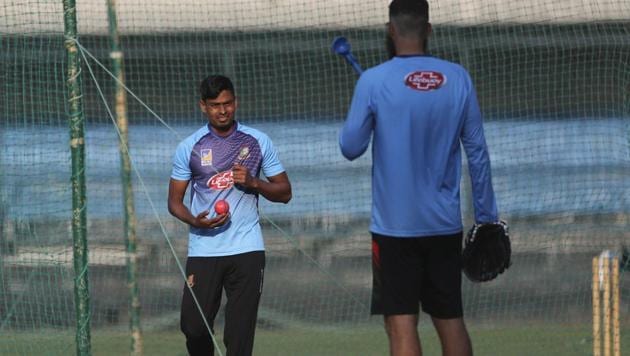 Bangladesh's Taijul Islam, left, holds a pink ball as he listens to bowling coach Daniel Vettori during a training session(AP) Bangladesh's Taijul Islam, left, holds a pink ball as he listens to bowling coach Daniel Vettori during a training session(AP)